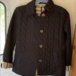 Burberry quilted jacket with plaid lining.